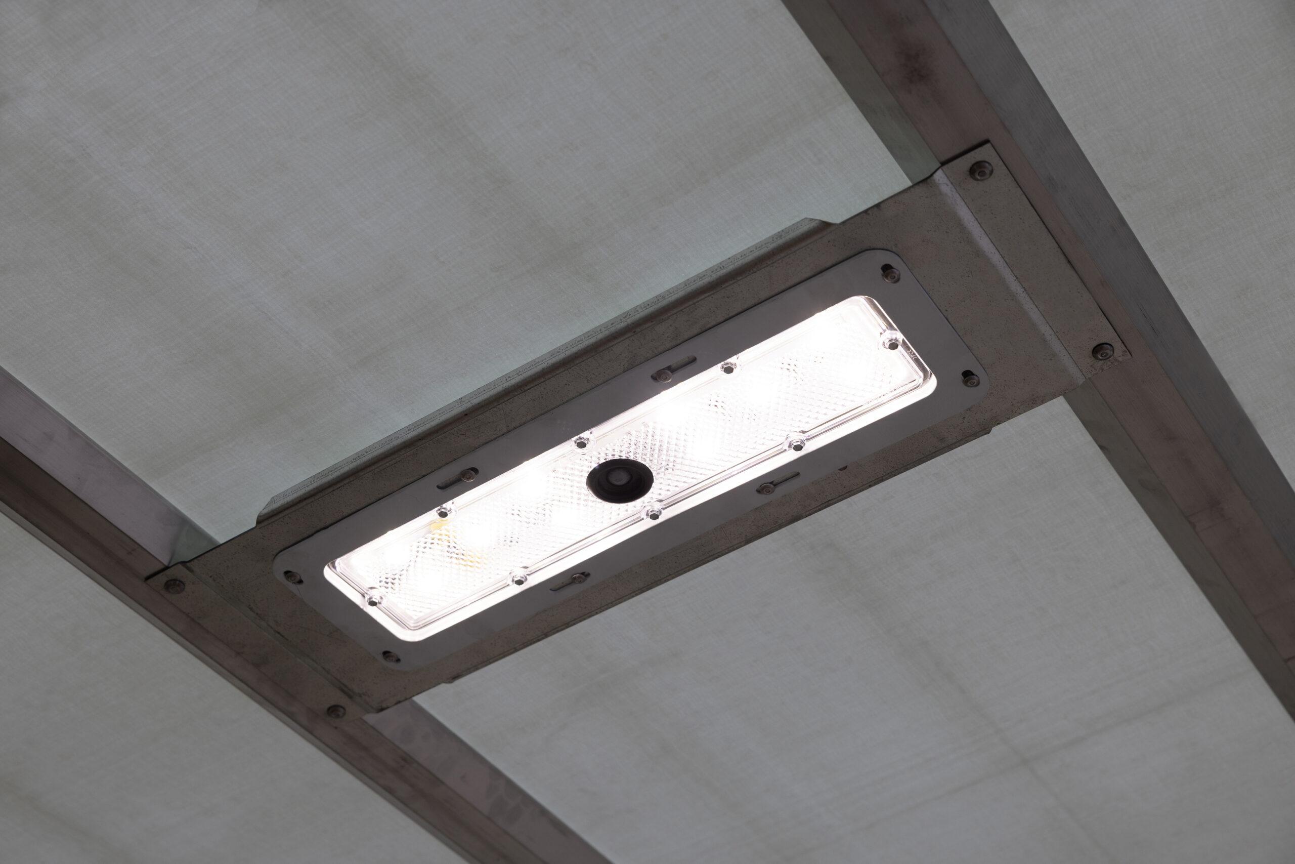 Close-up of an interior LED light fixture on the ceiling of a Hyundai Translead Anza truck body, showcasing the integrated lighting technology for improved visibility and safety.
