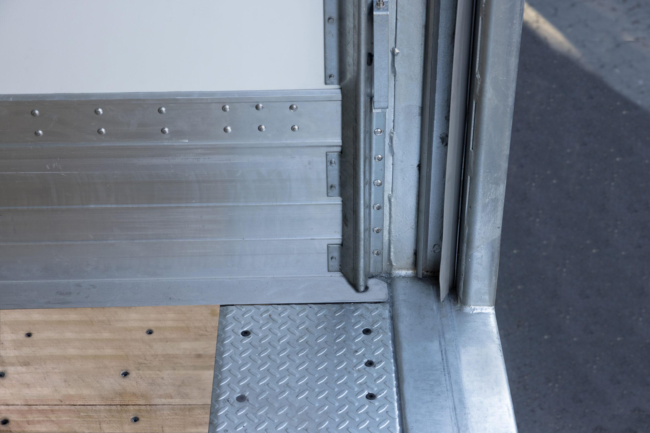 Close-up view of the rear corner of a Hyundai Translead Anza truck body, showing the robust threshold, floor, and side panel construction, highlighting Hyundai's truck body technology and durability.
