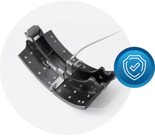 A close-up of a brake shoe for a Hyundai Translead trailer, with a safety icon, highlighting how HT TEMPS technology can help prevent issues leading to brake replacement, showcasing Hyundai's focus on trailer innovation and safety.