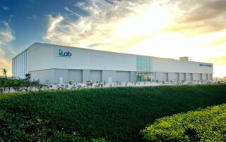 The exterior of Hyundai Translead's Innovation Lab (iLab) building, featuring modern architecture and landscaping, representing a dedicated facility for empowering greater innovation and quality in trailer technology to meet customer needs.