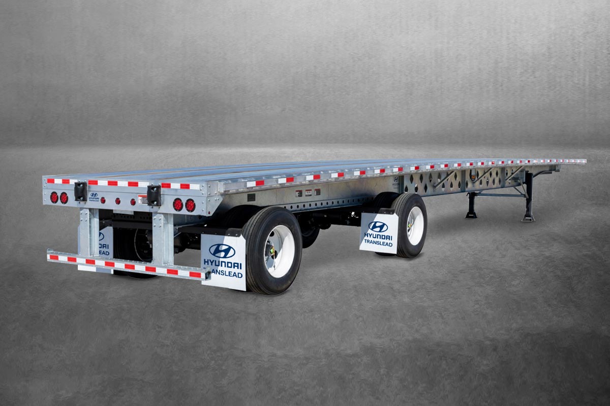 The silhouette of a Hyundai Translead flatbed on a gray background.
